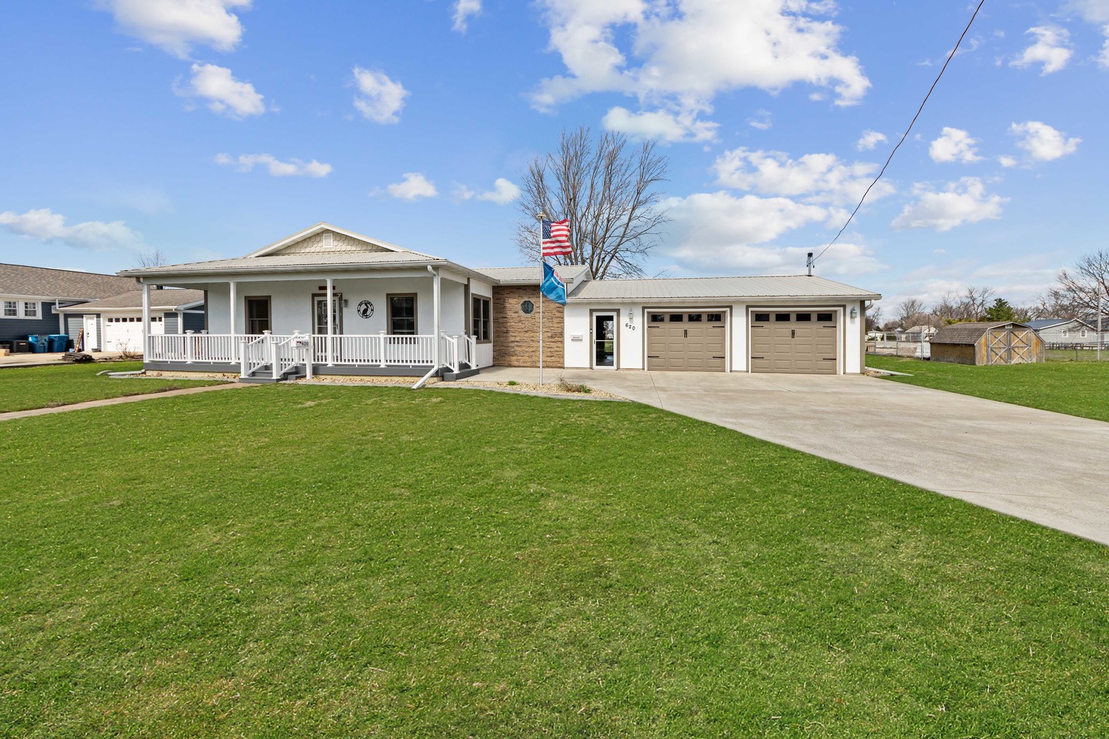 620 West 6th Street Minonk, IL 61760 - Photo 1 of 35 a front view of a house with a garden