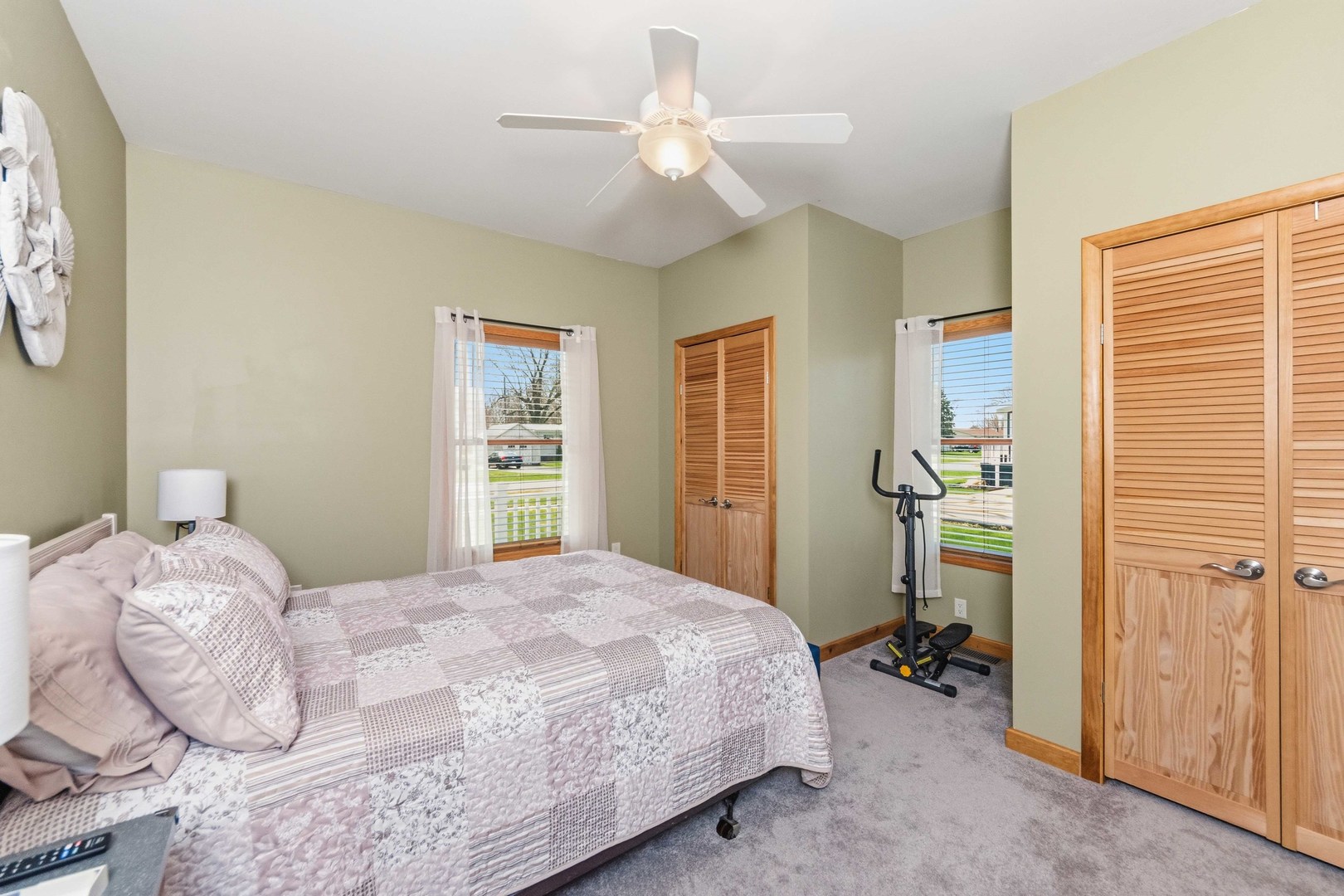 620 West 6th Street Minonk, IL 61760 - Photo 16 of 35 a bedroom with a bed and a chandelier