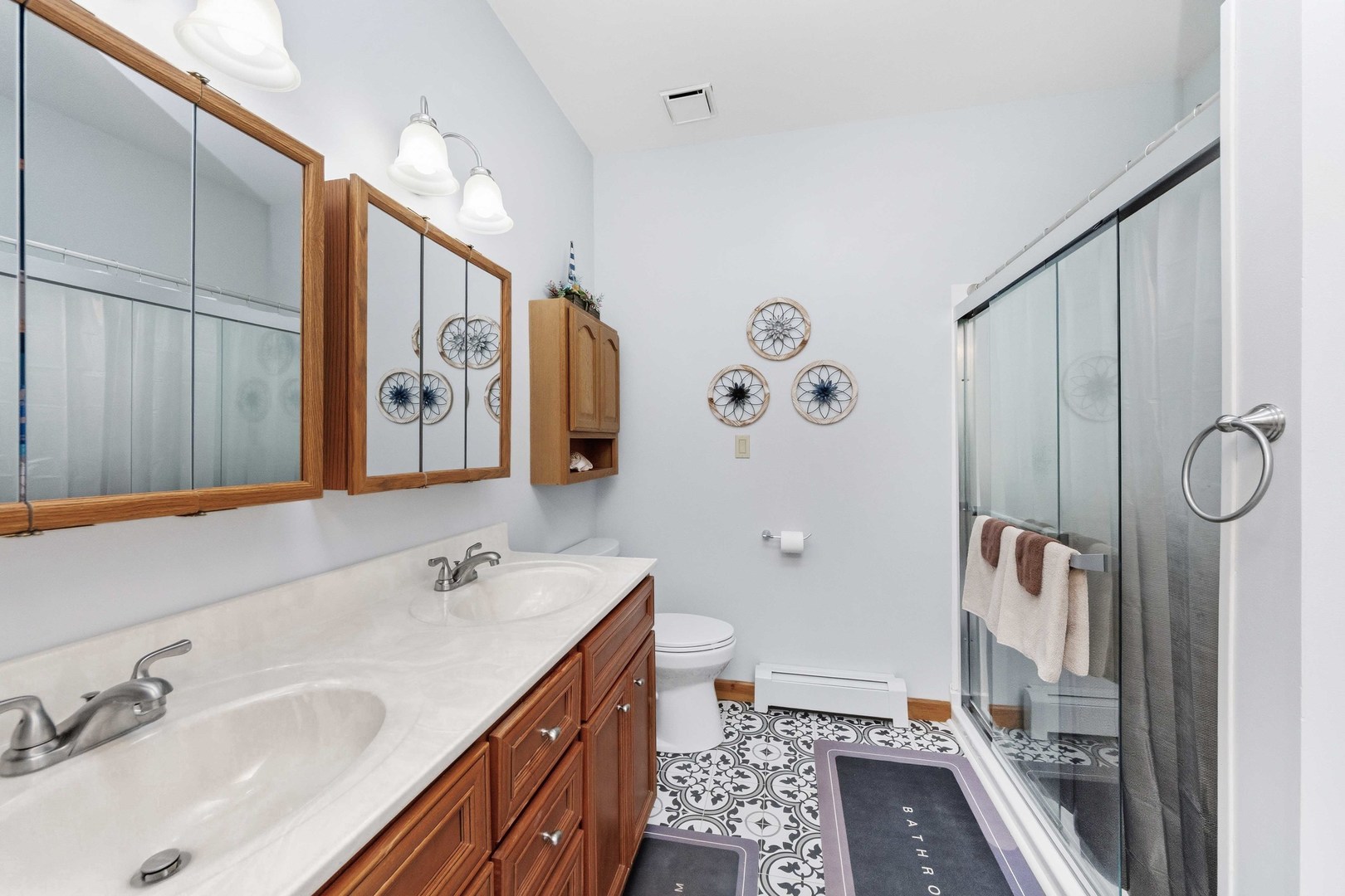 620 West 6th Street Minonk, IL 61760 - Photo 22 of 35 a bathroom with double vanity sink and mirror