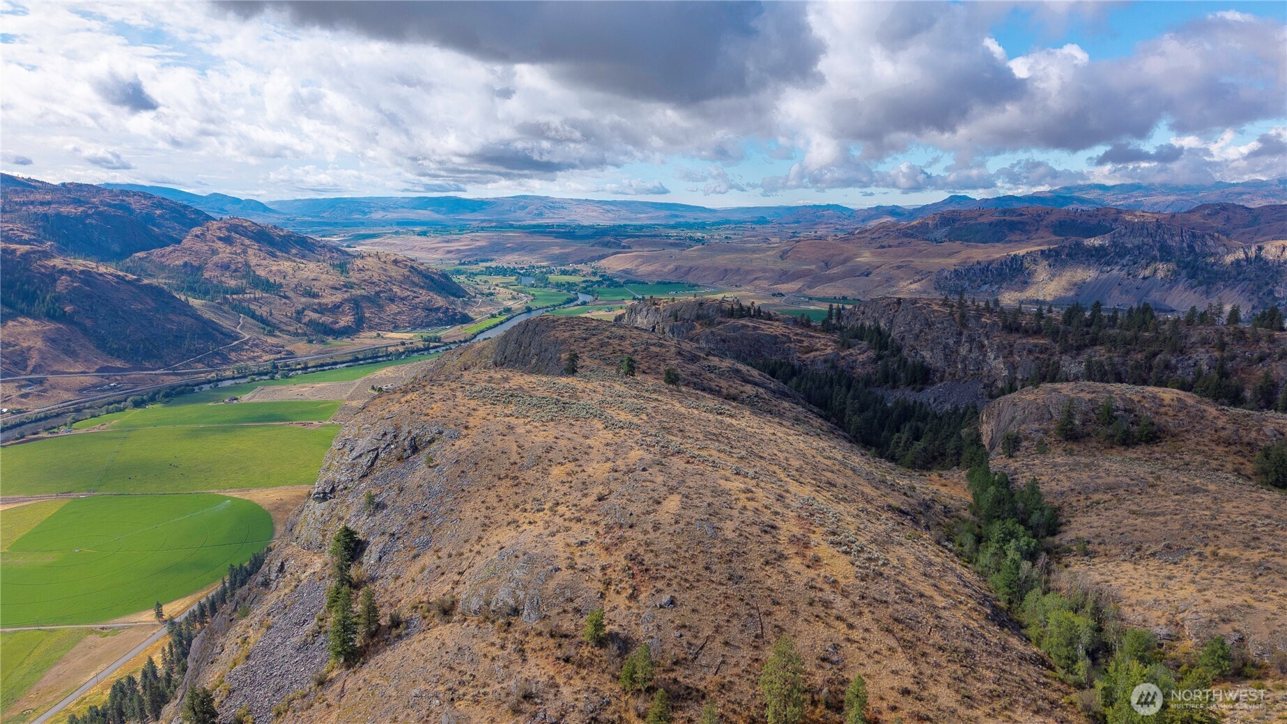 0 Tbd Pharr Out - 13 Way Riverside, WA 98849 - Photo 6 of 10 a view of a field with mountains in the background