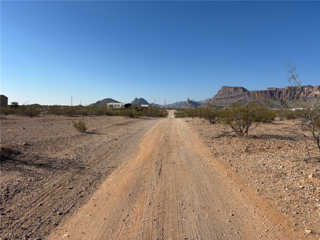 . South Guthrie Road Golden Valley, AZ 86413 - Photo 4 of 17 a view of a dry yard with mountain