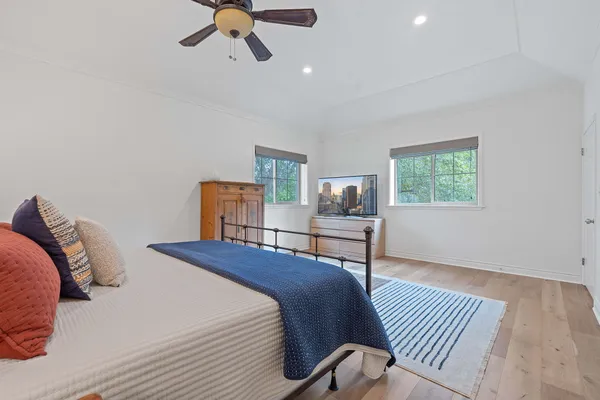 a bedroom with a bed and a table