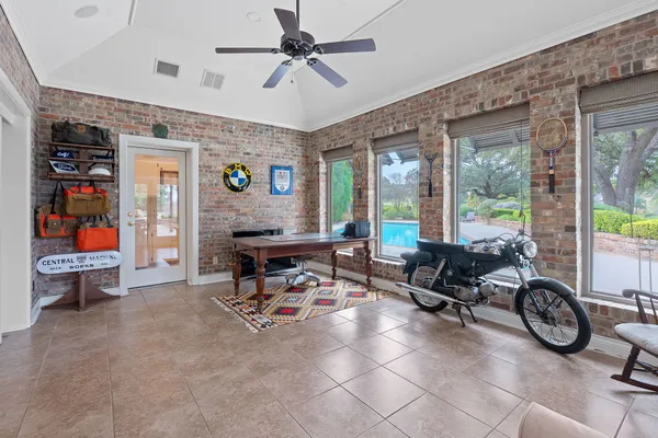 a living room with furniture a window and a chandelier