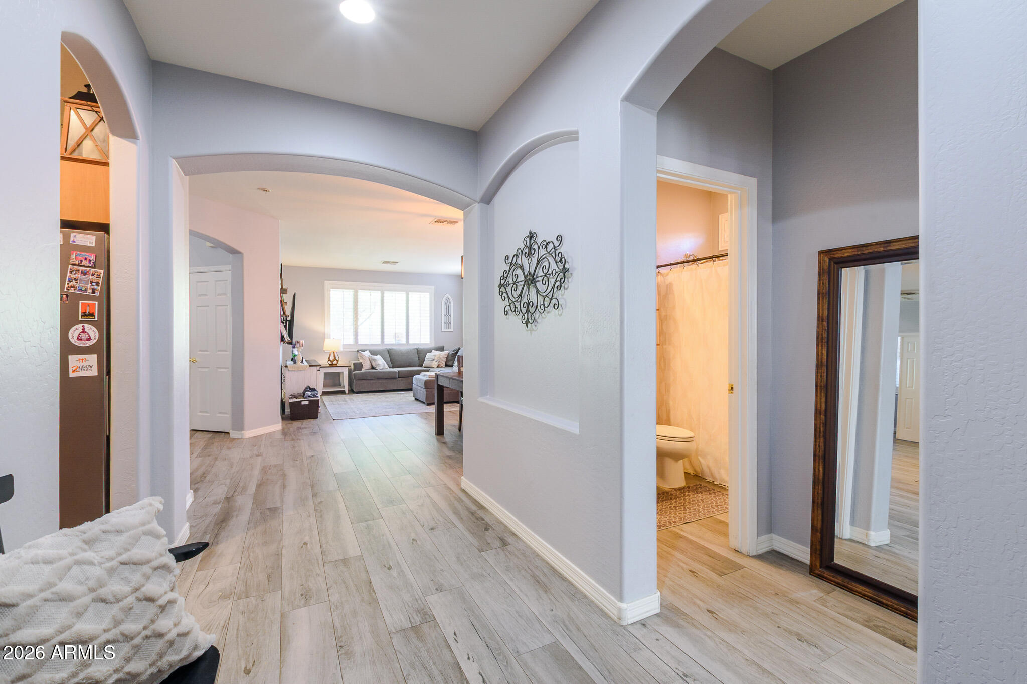 4521 West Moss Springs Road Anthem, AZ 85086 - Photo 8 of 35 a view of a livingroom with wooden floor and furniture