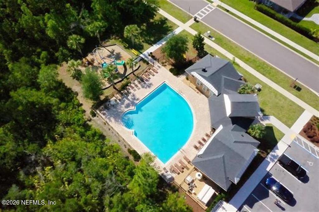 115 Sierras Loop St. Augustine, FL 32086 - Photo 59 of 65 an aerial view of a house with a yard and trees