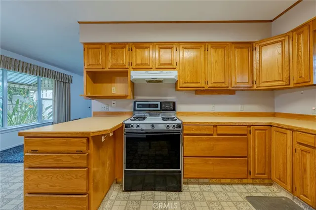 a kitchen with a stove and a cabinet