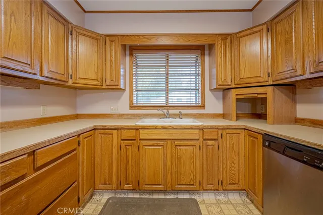 a kitchen with stainless steel appliances granite countertop a sink and cabinets