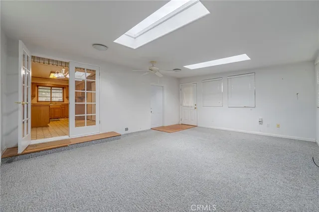 a view of empty room with windows