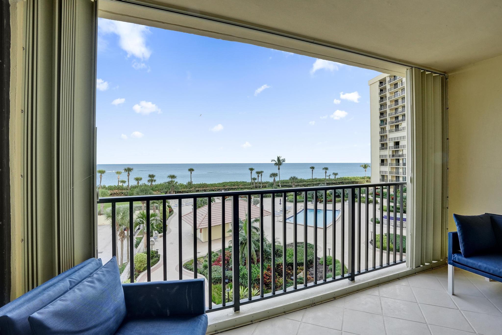 300 Ocean Trail Way, Unit 410 Jupiter, FL 33477 - Photo 2 of 58 a view of a balcony with furniture