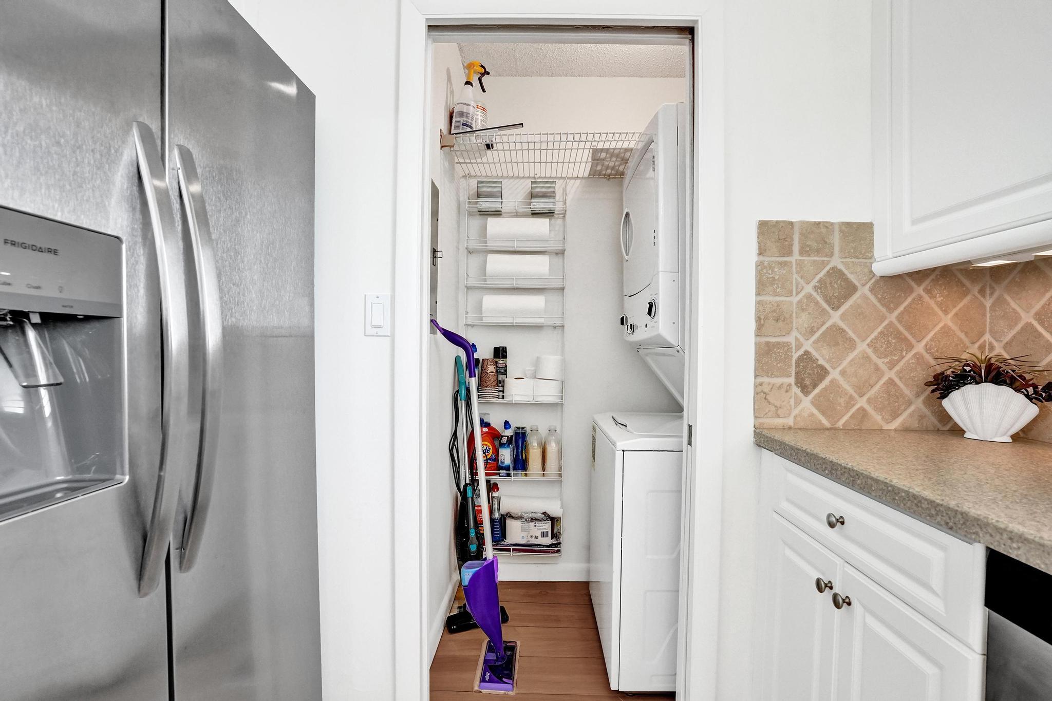 300 Ocean Trail Way, Unit 410 Jupiter, FL 33477 - Photo 21 of 58 a view of walk in closet with clothes and shoes
