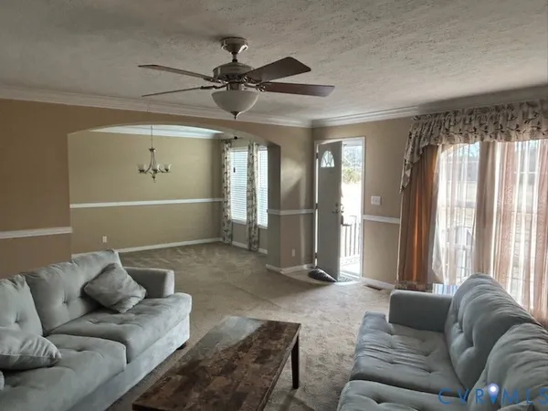 a living room with furniture and a window