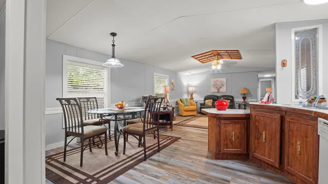 a dining room with furniture and window