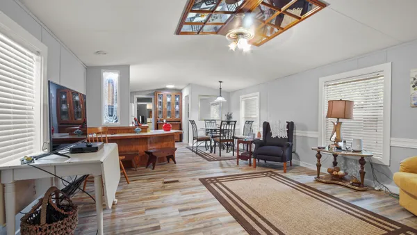 a view of a dining room with furniture window and outside view
