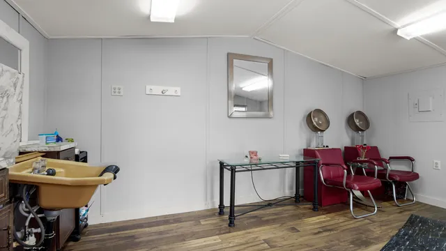 a reading room with furniture and wooden floor