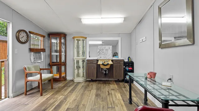 a view of a hallway with seating area