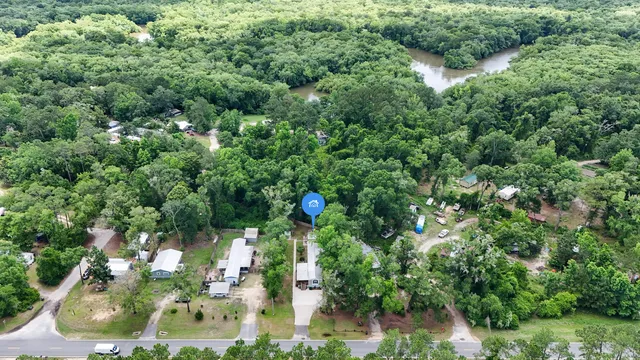 an aerial view of house with yard
