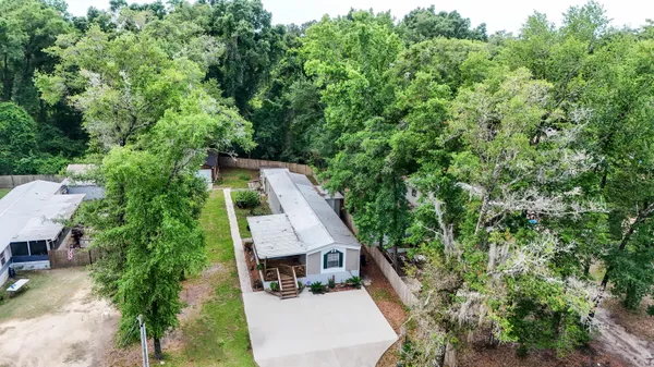 an aerial view of house with yard