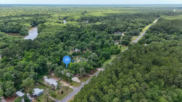 an aerial view of a house with a yard