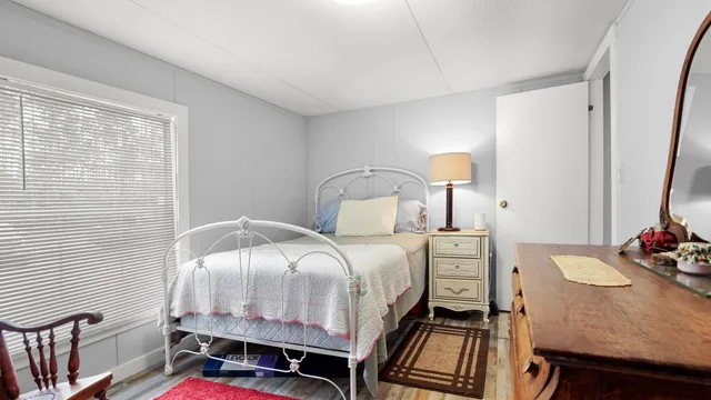 a bedroom with a bed and a dresser