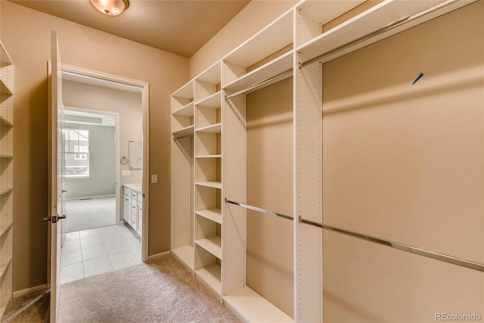 5052 West 109th Circle Westminster, CO 80031 - Photo 19 of 30 a view of closet area with rug