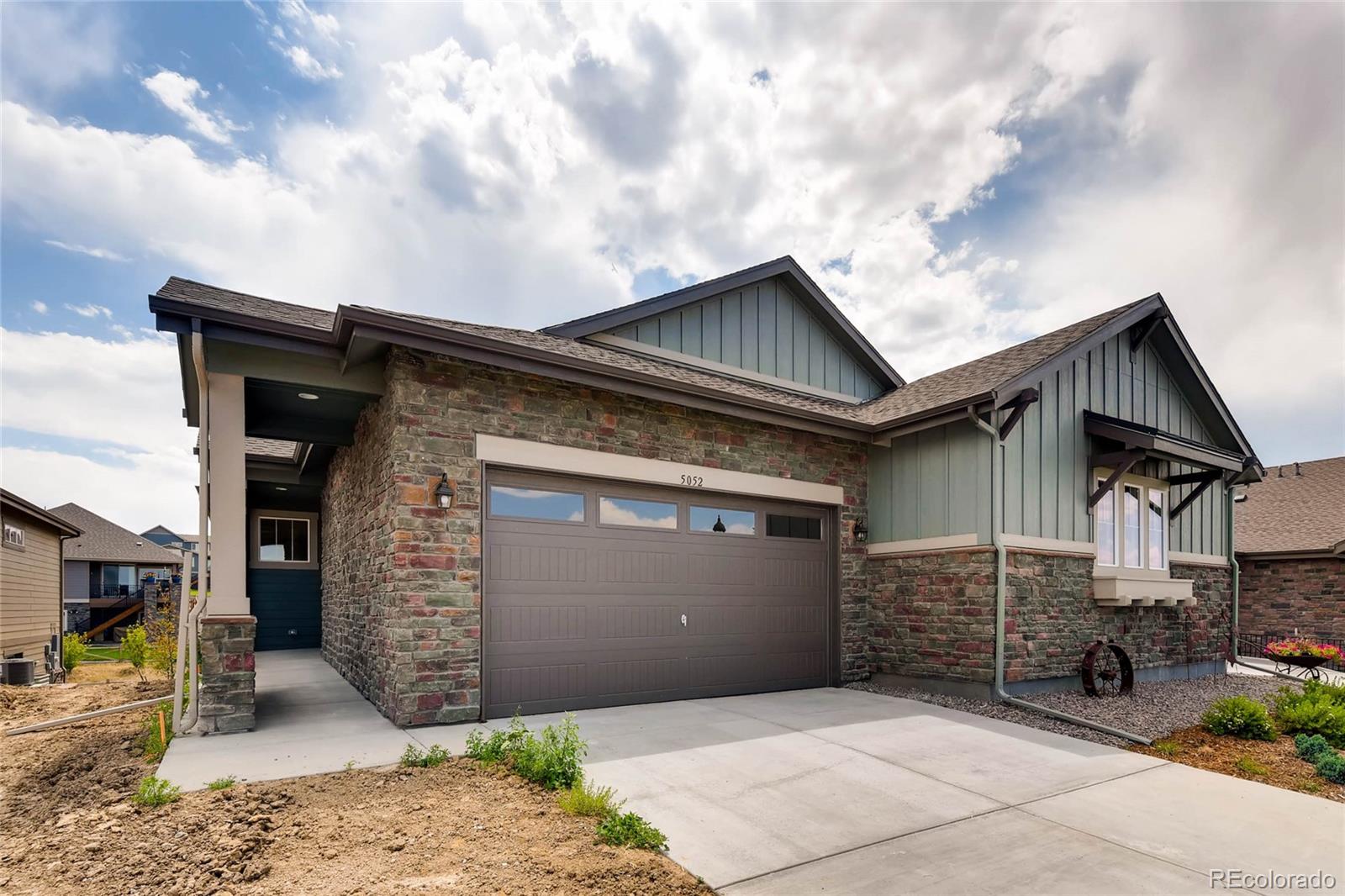 5052 West 109th Circle Westminster, CO 80031 - Photo 2 of 30 a front view of a house with a garage