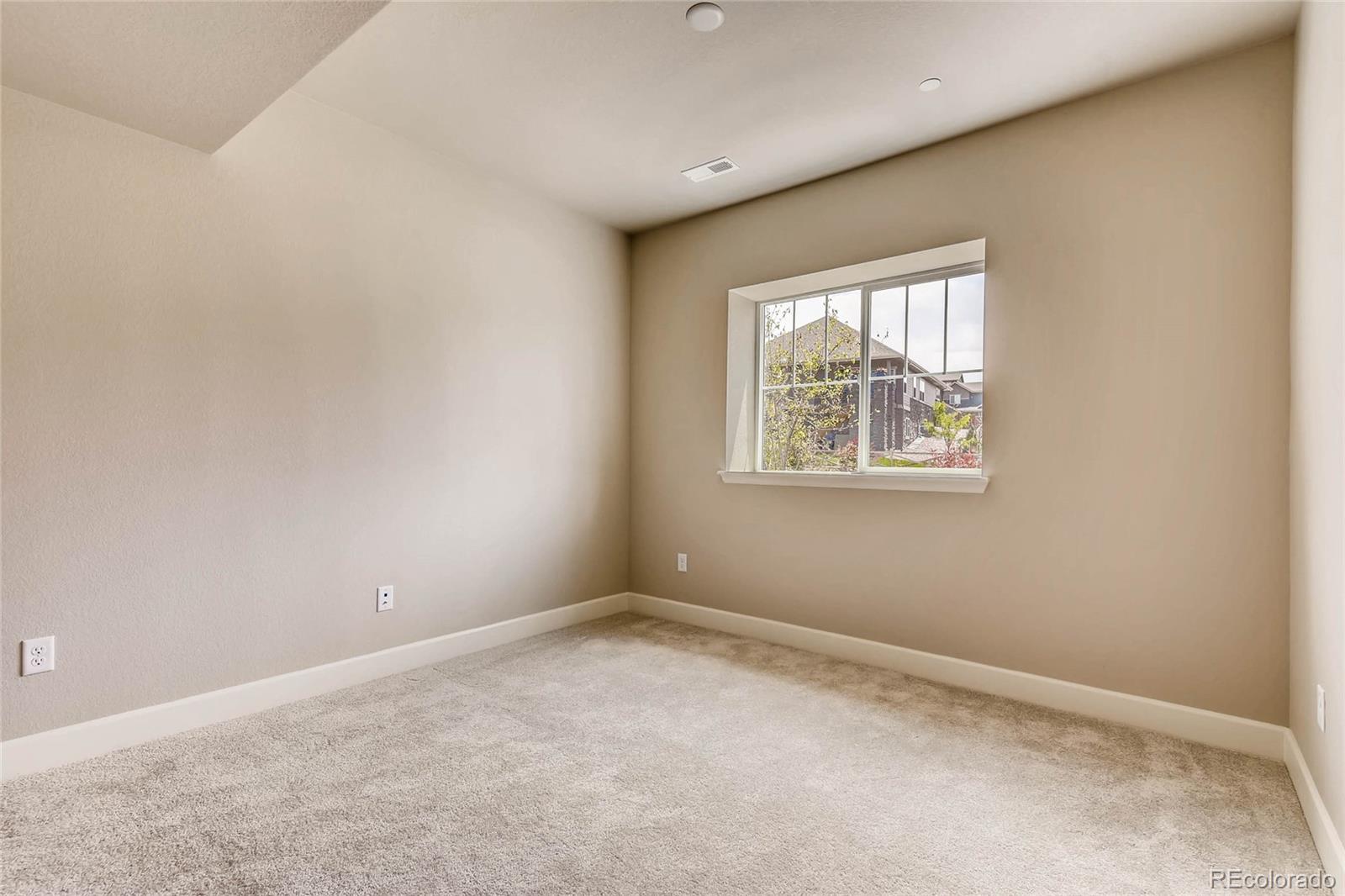 5052 West 109th Circle Westminster, CO 80031 - Photo 22 of 30 an empty room with windows