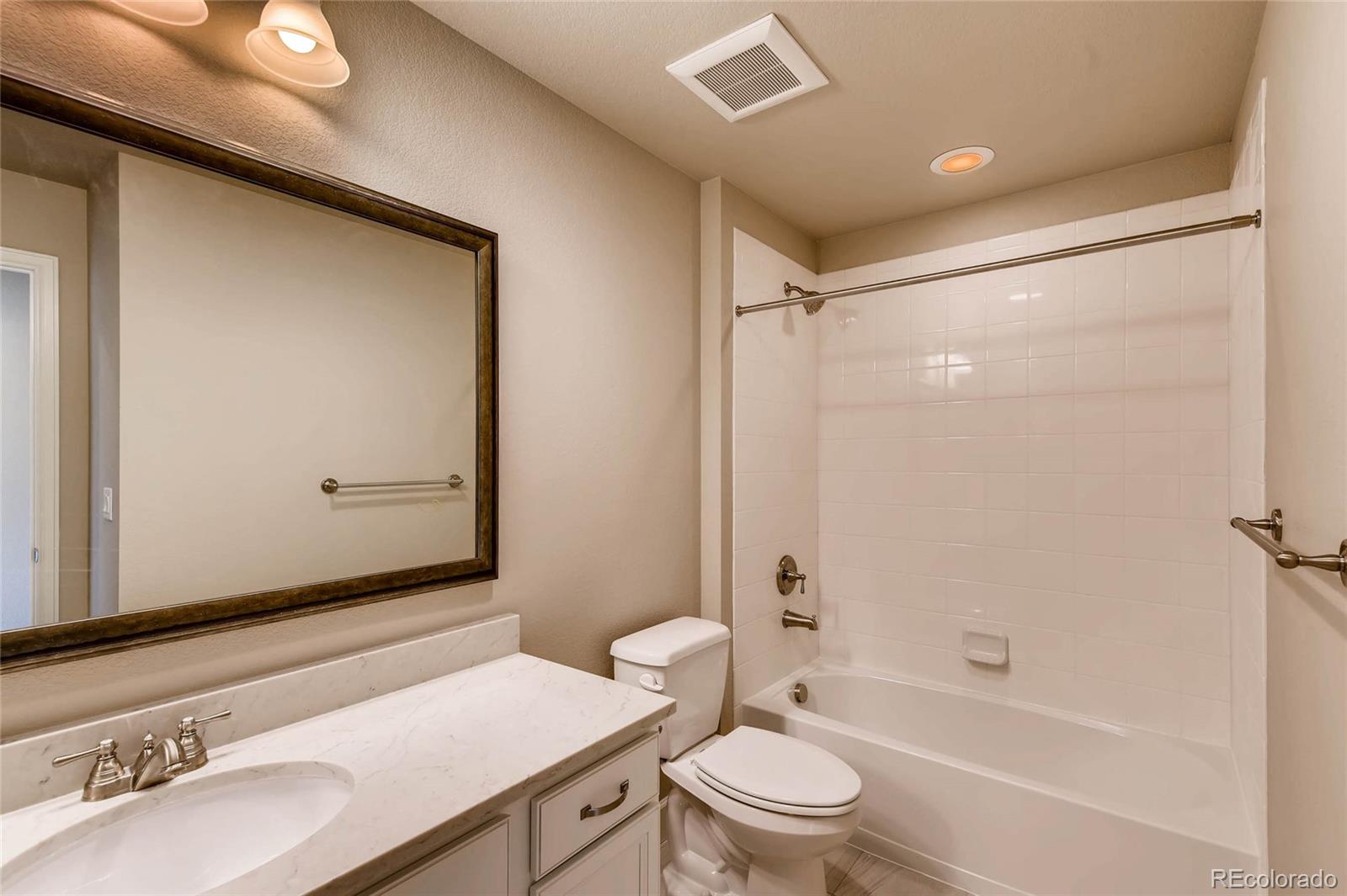 5052 West 109th Circle Westminster, CO 80031 - Photo 24 of 30 a bathroom with a sink and a mirror
