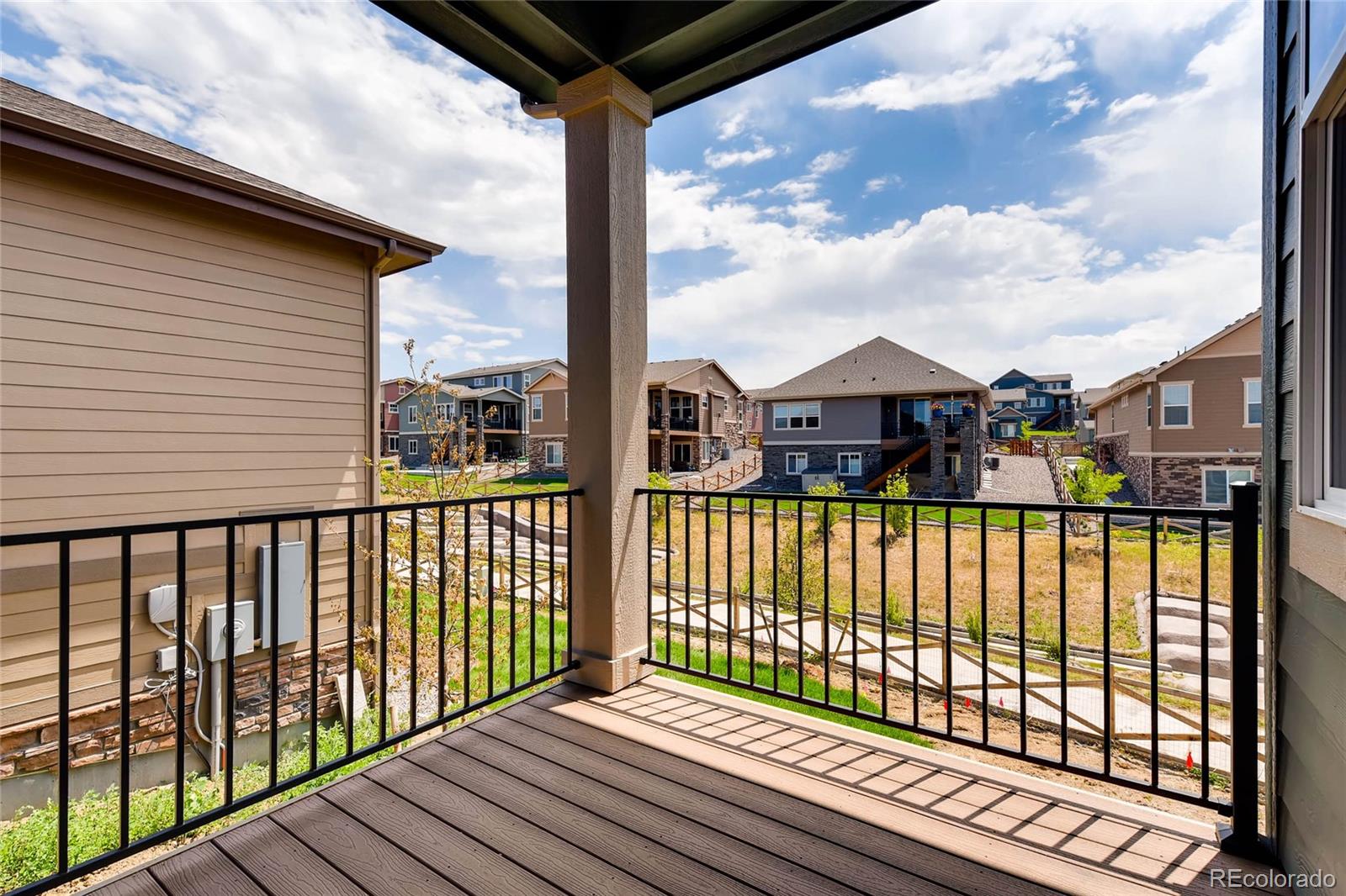 5052 West 109th Circle Westminster, CO 80031 - Photo 26 of 30 a view of a balcony with wooden floor