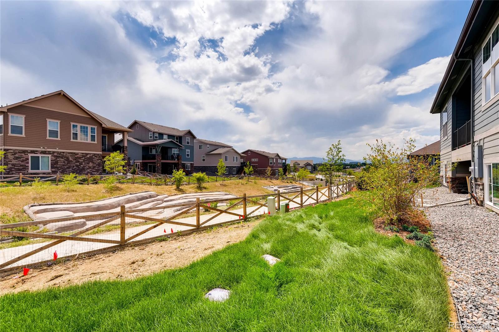 5052 West 109th Circle Westminster, CO 80031 - Photo 27 of 30 a view of a house with a big yard and a large tree