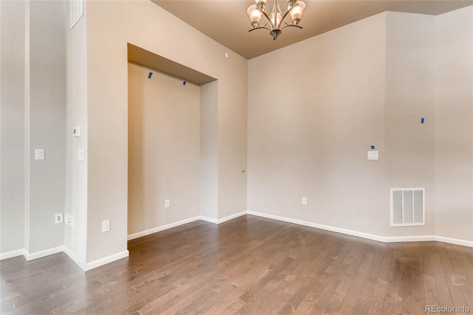 5052 West 109th Circle Westminster, CO 80031 - Photo 6 of 30 a view of a room with wooden floor