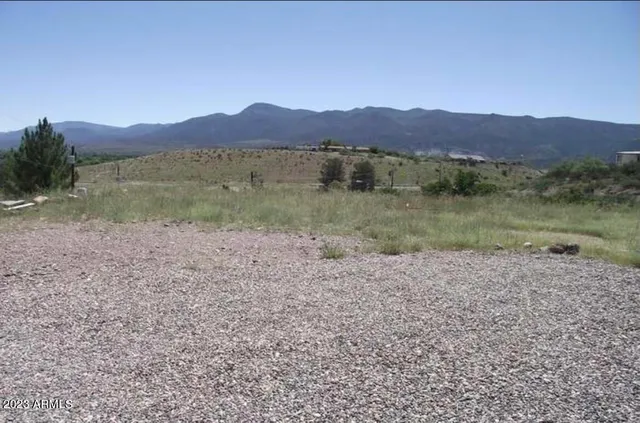 a view of a town with mountains in the background