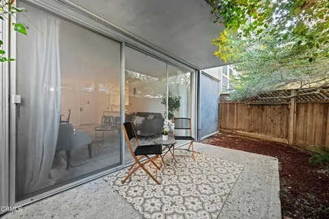 a view of a backyard with a patio