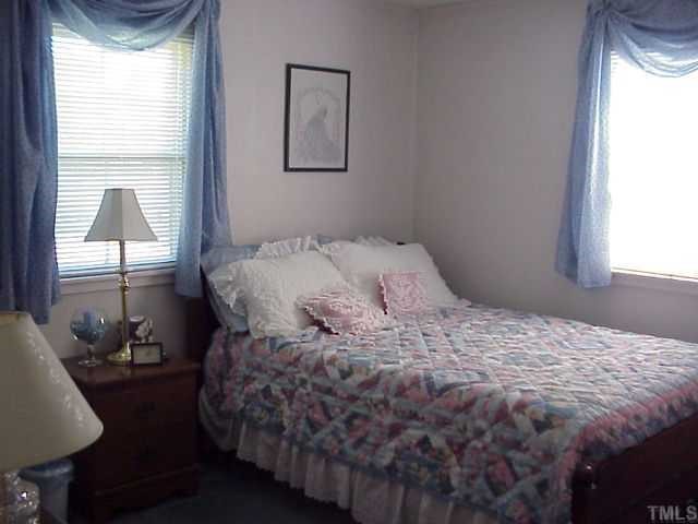 90 Pine Ridge Road Henderson, NC 27537 - Photo 5 of 11 Bedroom at the end of the house with two windows