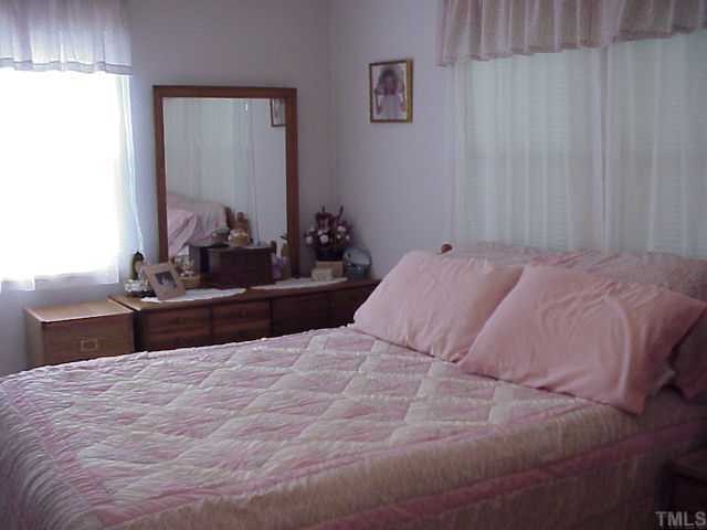 90 Pine Ridge Road Henderson, NC 27537 - Photo 6 of 11 Spacious master bedroom with privated updated shower