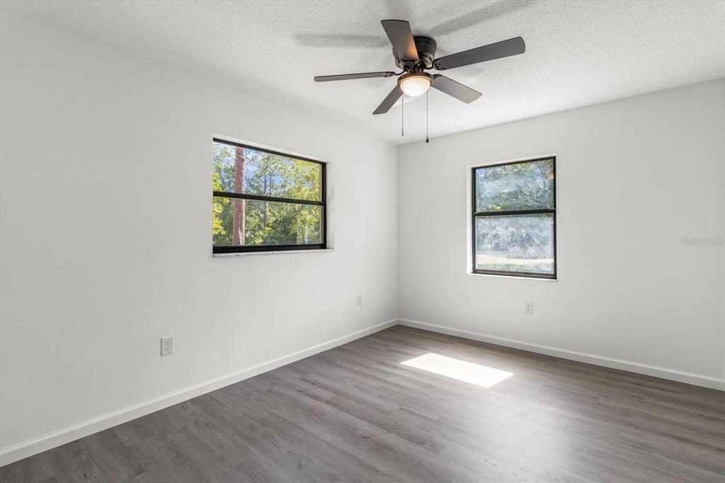 5700 South Calgary Terrace Inverness, FL 34452 - Photo 14 of 39 a view of empty room with wooden floor