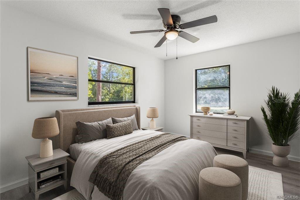 5700 South Calgary Terrace Inverness, FL 34452 - Photo 15 of 39 a bedroom with a large bed and a window