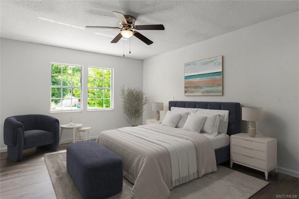 5700 South Calgary Terrace Inverness, FL 34452 - Photo 19 of 39 a bedroom with a bed furniture and a window