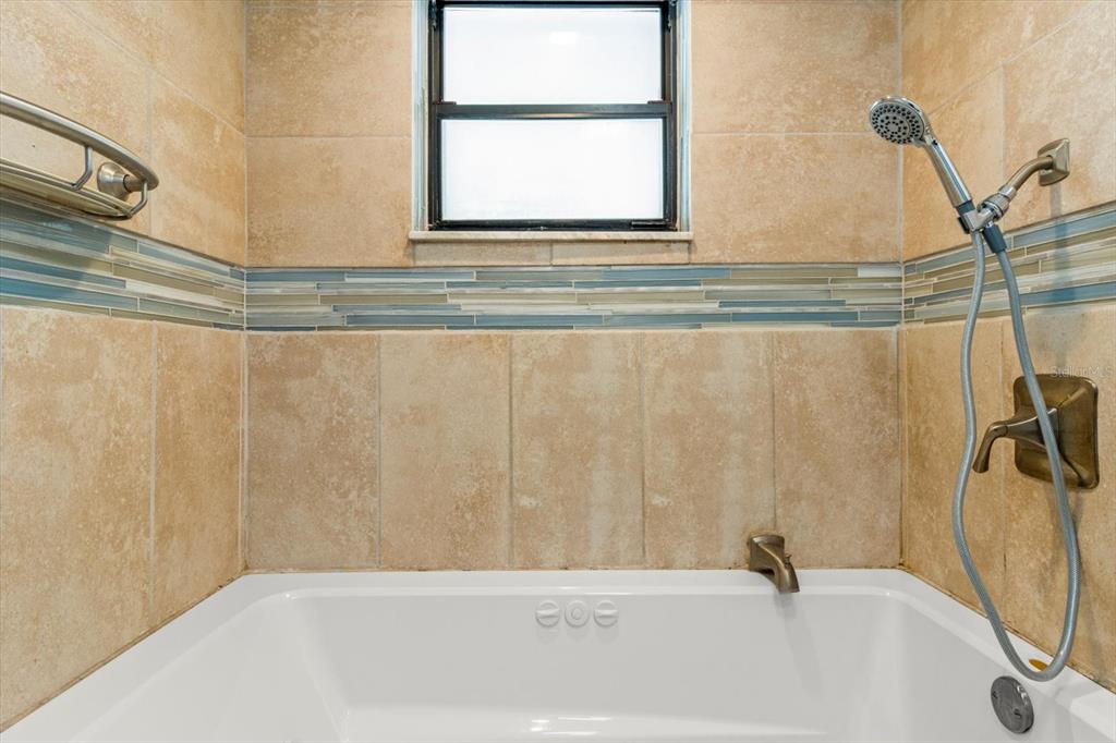 5700 South Calgary Terrace Inverness, FL 34452 - Photo 24 of 39 a bathroom with a bathtub and a shower