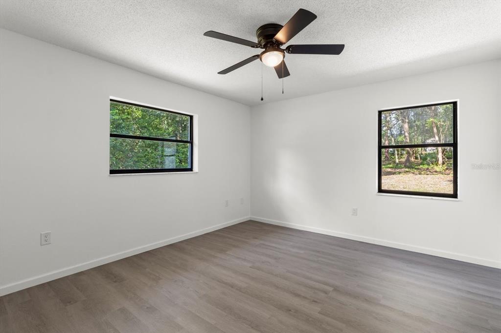 5700 South Calgary Terrace Inverness, FL 34452 - Photo 25 of 39 a view of a ceiling fan with wooden floor