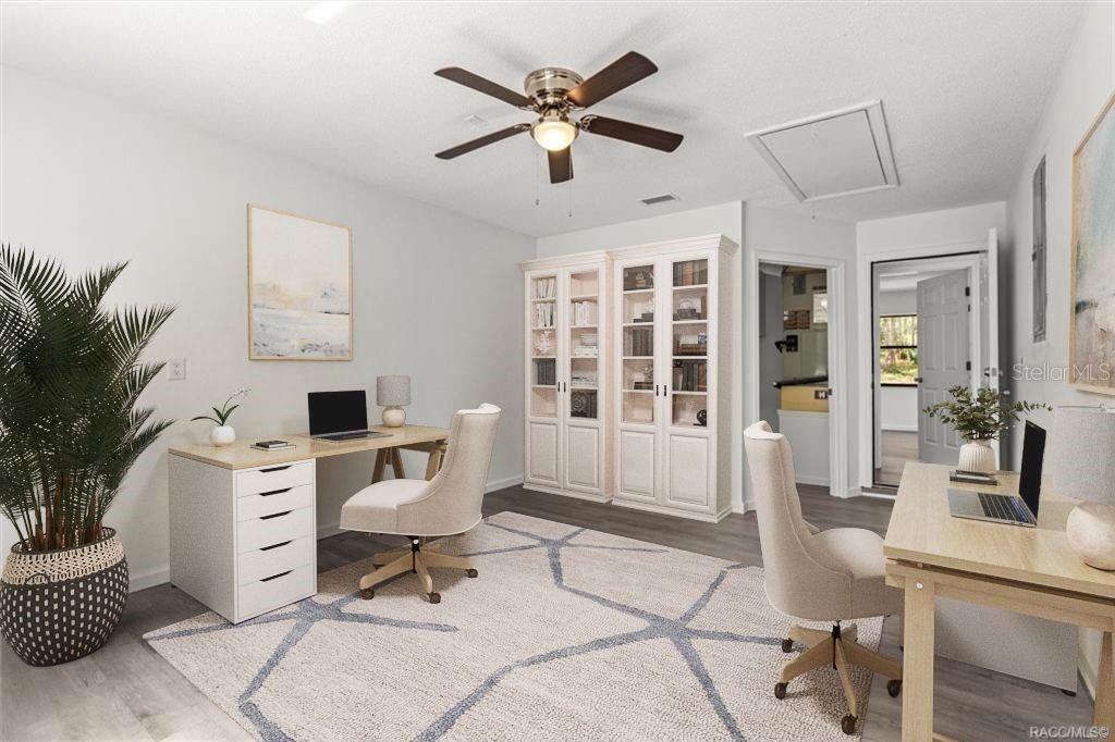 5700 South Calgary Terrace Inverness, FL 34452 - Photo 26 of 39 a living room with furniture a table and a potted plant