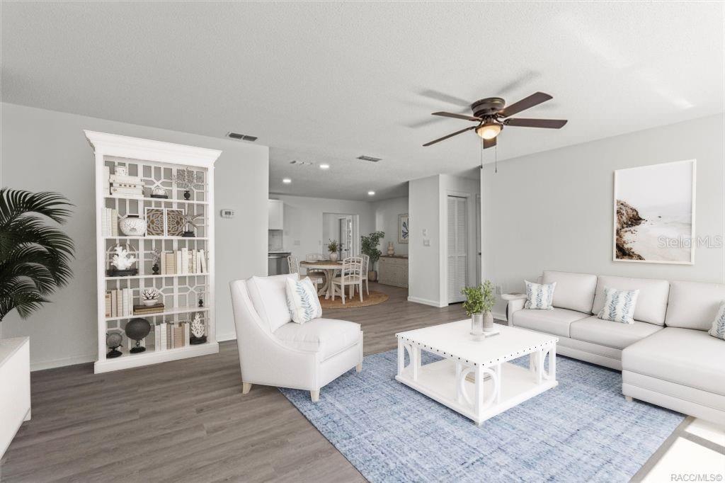 5700 South Calgary Terrace Inverness, FL 34452 - Photo 3 of 39 a living room with furniture and a large window