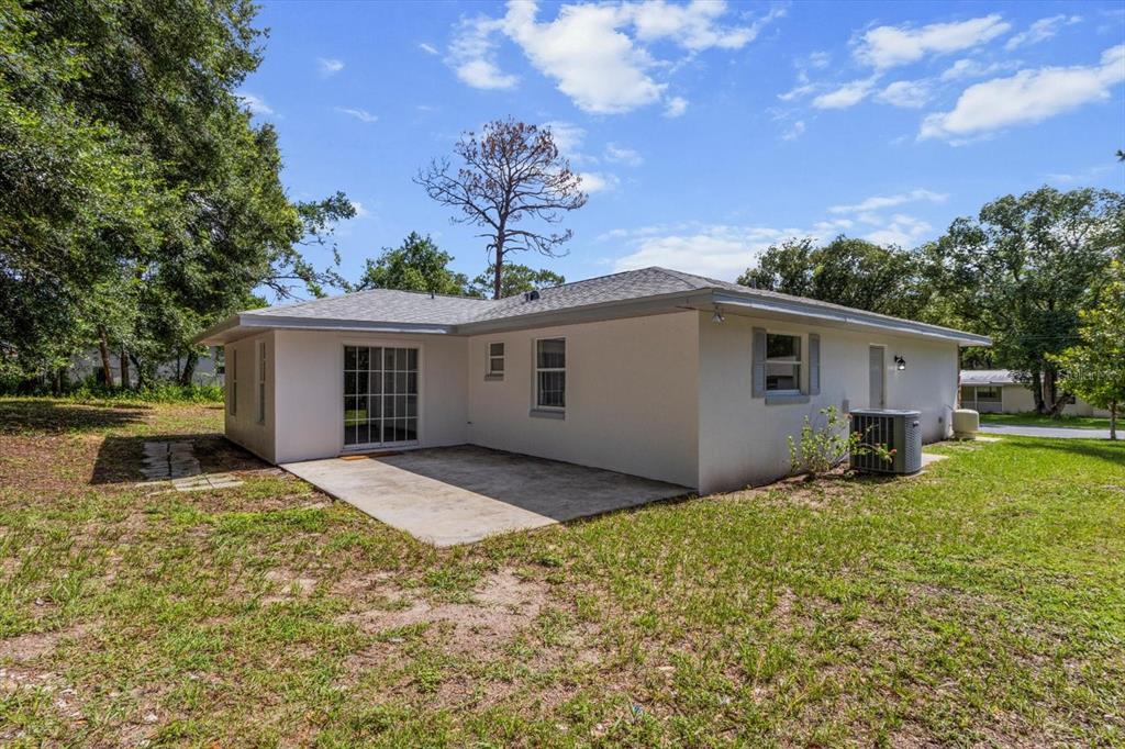 5700 South Calgary Terrace Inverness, FL 34452 - Photo 34 of 39 a view of a house with backyard and a tree
