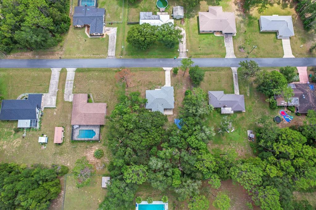 5700 South Calgary Terrace Inverness, FL 34452 - Photo 37 of 39 an aerial view of residential houses with outdoor space and swimming pool