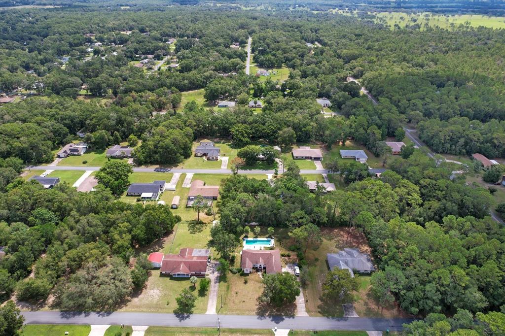5700 South Calgary Terrace Inverness, FL 34452 - Photo 38 of 39 an aerial view of residential house with outdoor space and trees all around