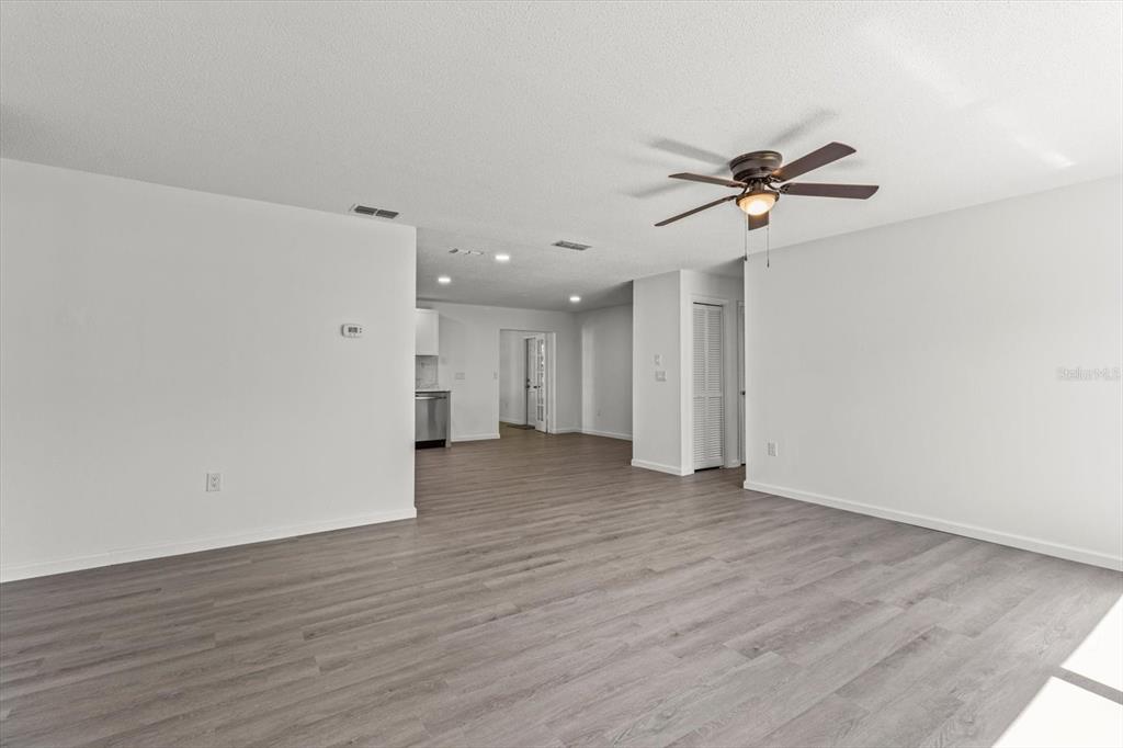5700 South Calgary Terrace Inverness, FL 34452 - Photo 4 of 39 a view of room with wooden floor and ceiling fan