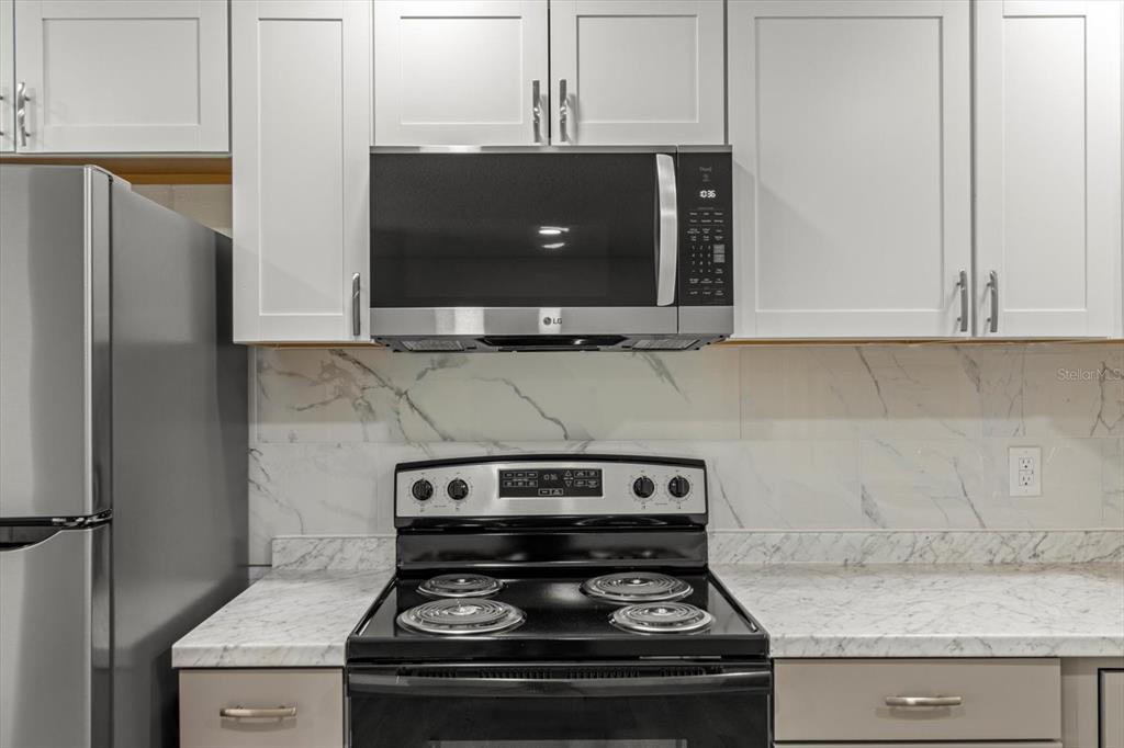 5700 South Calgary Terrace Inverness, FL 34452 - Photo 10 of 39 a stove top oven sitting inside of a kitchen