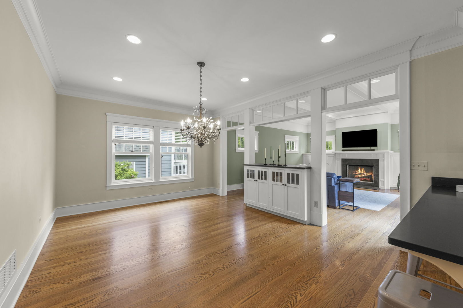 900 East Indiana Street Wheaton, IL 60187 - Photo 11 of 54 a view of a living room and kitchen with furniture wooden floor and window