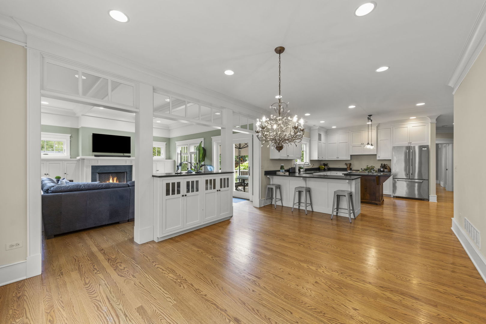 900 East Indiana Street Wheaton, IL 60187 - Photo 13 of 54 a large kitchen with a center island and wooden floor