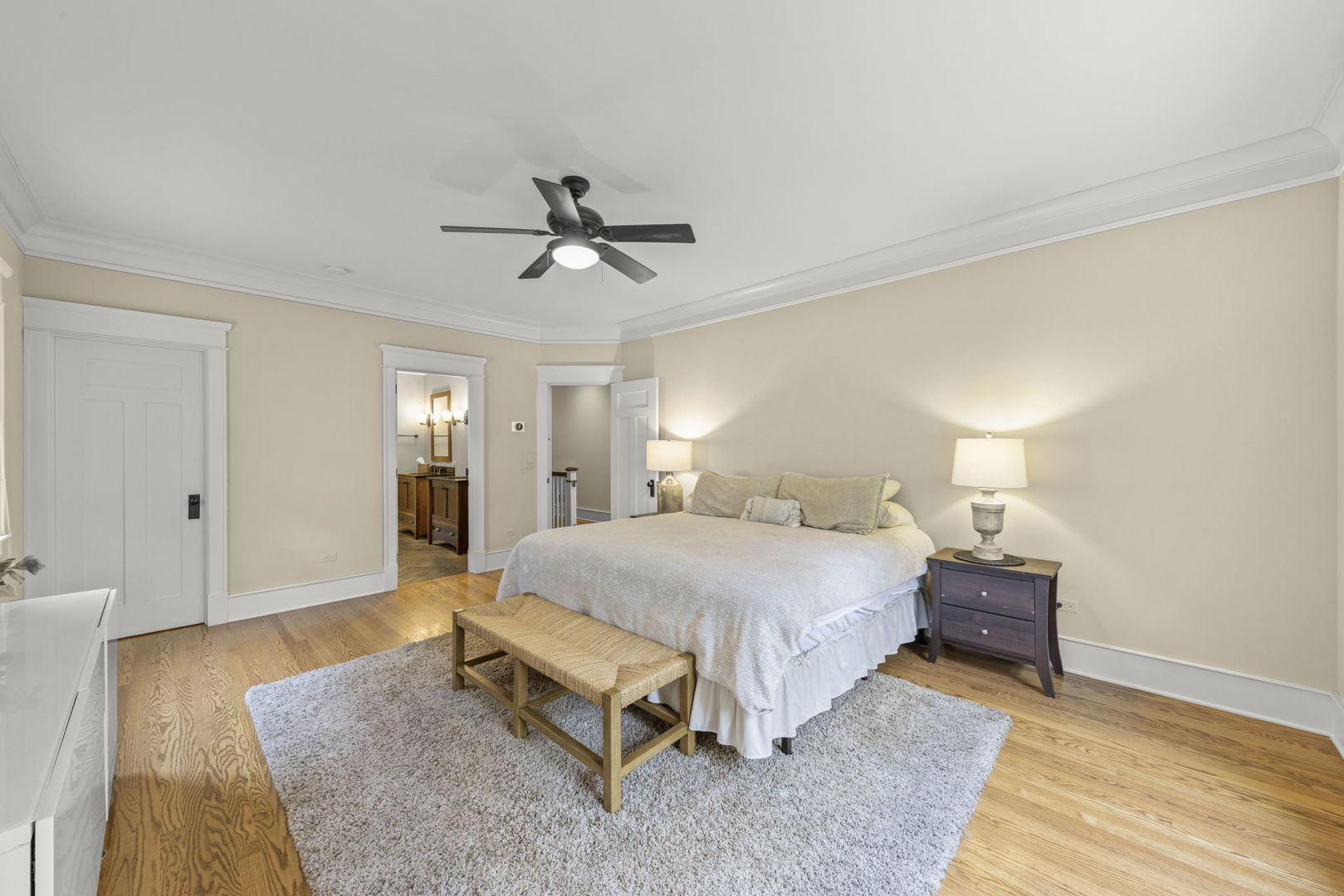 900 East Indiana Street Wheaton, IL 60187 - Photo 20 of 54 a spacious bedroom with a bed and a table