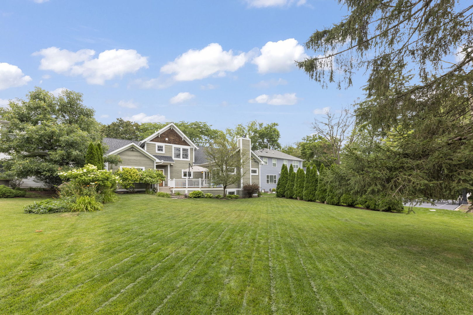 900 East Indiana Street Wheaton, IL 60187 - Photo 41 of 54 a view of a house with a big yard and large trees